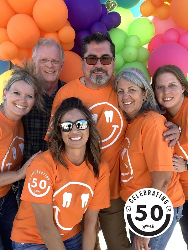 Smile Xpressions Dentistry team celebrating 50 years