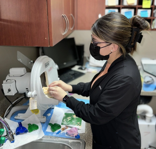 Dental technician crafting a custom crown at Smile Xpressions Dentistry in Artesia, NM